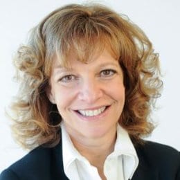 A smiling woman with brown hair