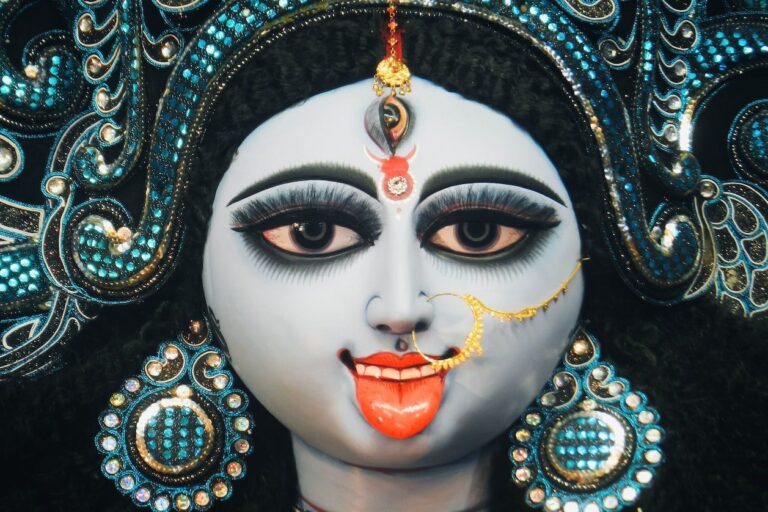 A close up of the face of an indian deity