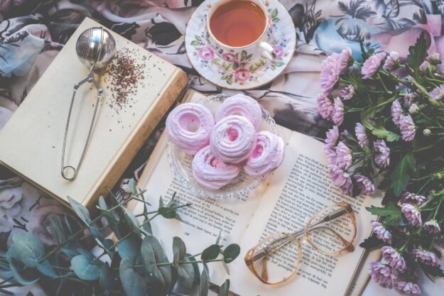 A book with pink donuts and glasses on it